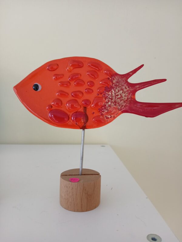 Orange fused glass fish on wooden base